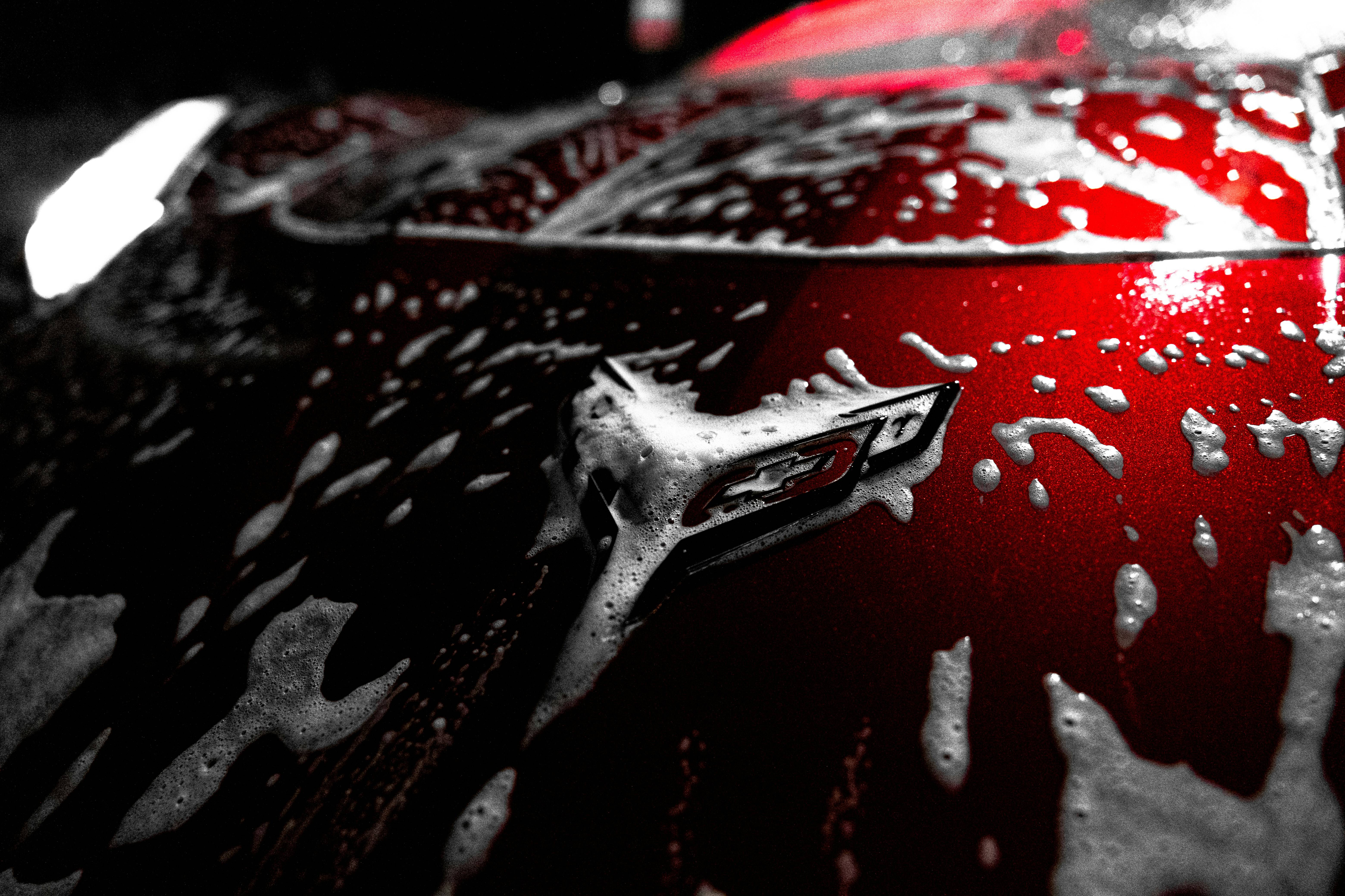 Premium luxury car being detailed with professional equipment